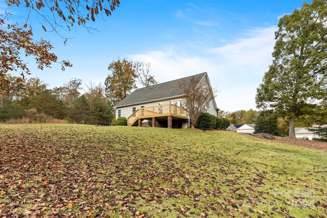 view of yard featuring a wooden deck