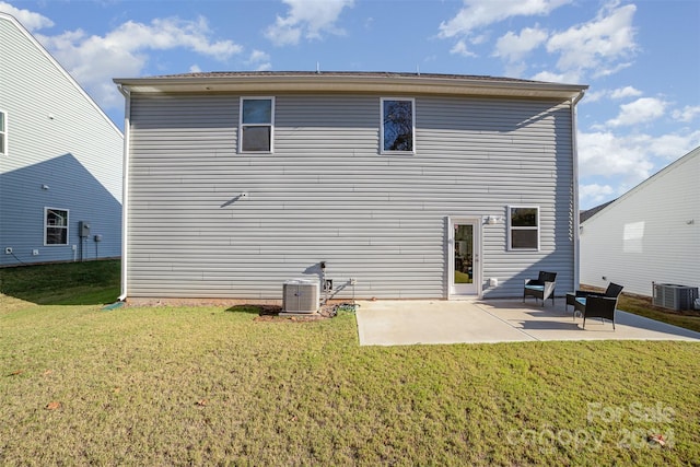 back of house with a yard, a patio, and cooling unit