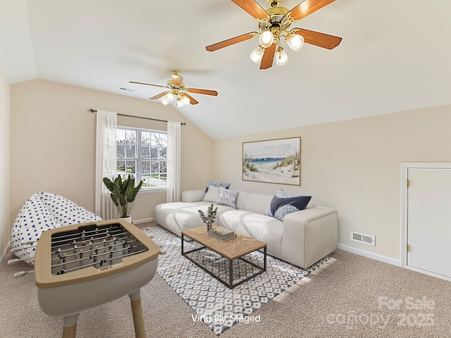 living room featuring carpet flooring, ceiling fan, and lofted ceiling