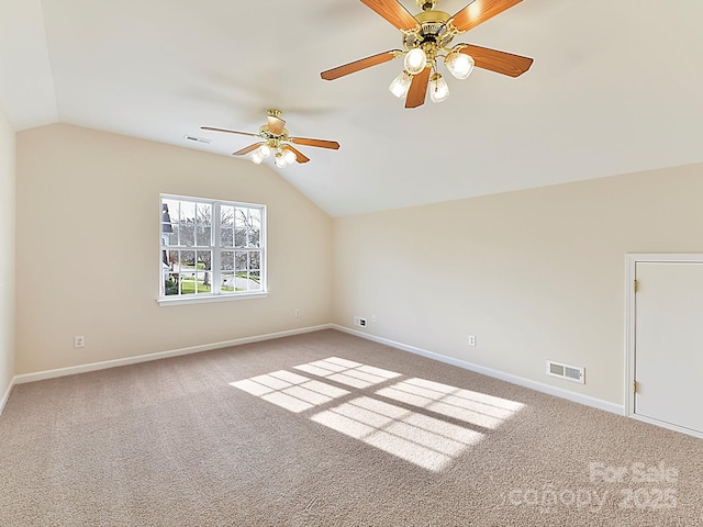 additional living space with carpet, ceiling fan, and vaulted ceiling