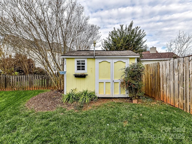 view of outdoor structure with a lawn