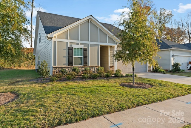 view of front facade with a garage and a front lawn