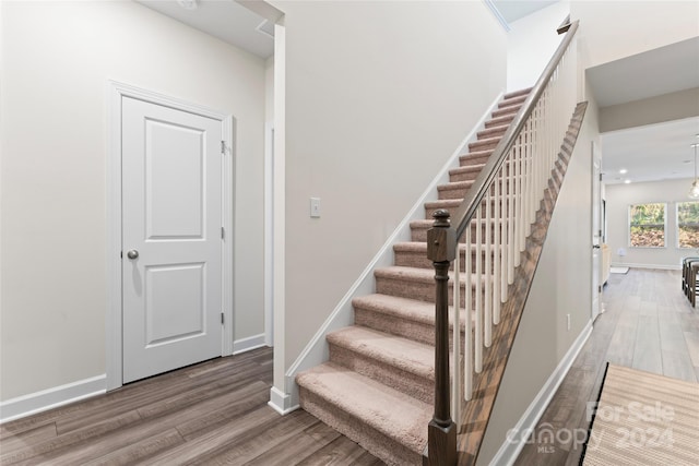 stairway featuring hardwood / wood-style floors