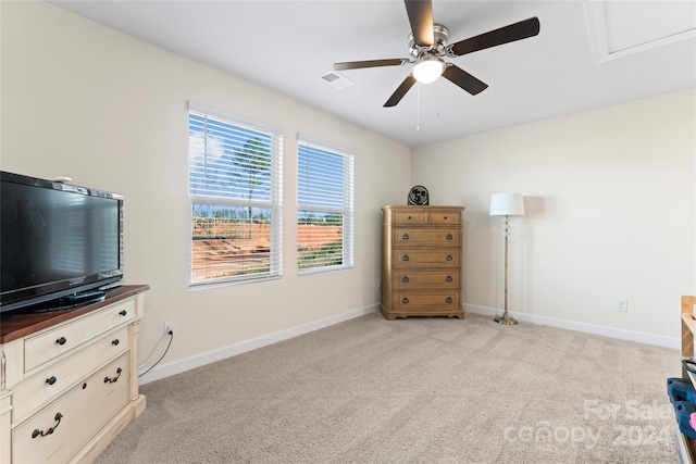 miscellaneous room featuring ceiling fan and light colored carpet