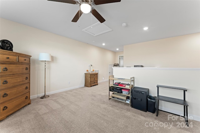 misc room with light carpet and ceiling fan