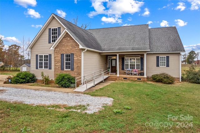 view of front property featuring a front lawn and a porch