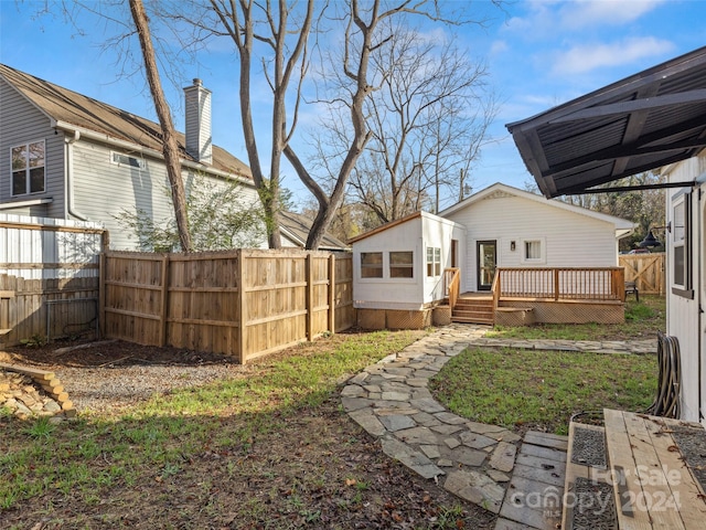 view of yard with a wooden deck