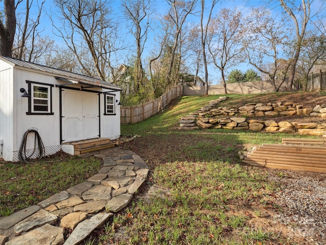 view of yard with a storage unit