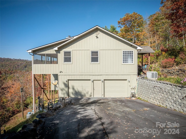 view of side of home with a garage