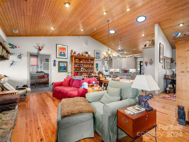 living room with vaulted ceiling, wooden ceiling, and light hardwood / wood-style floors