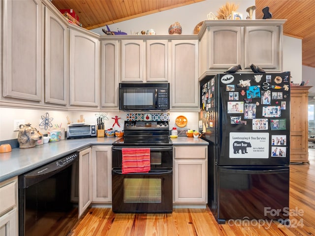 kitchen featuring wooden ceiling, light hardwood / wood-style floors, black appliances, and lofted ceiling