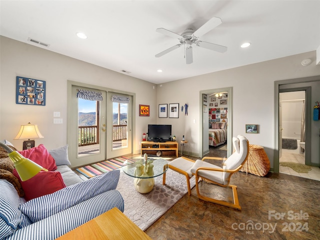 living room featuring french doors and ceiling fan