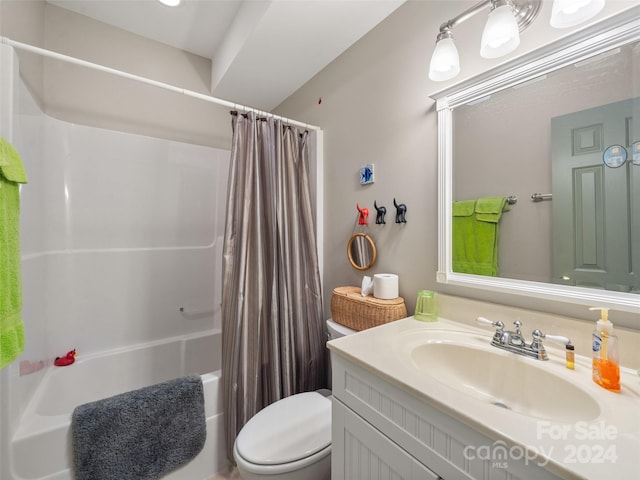 full bathroom with vanity, shower / bath combination with curtain, and toilet