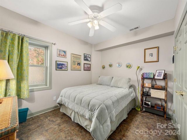 bedroom featuring ceiling fan and a closet