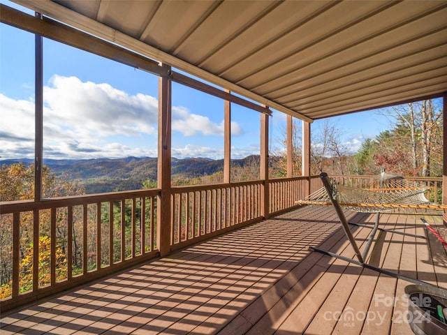 wooden deck with a mountain view