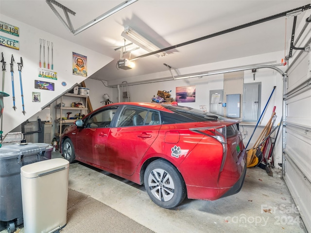 garage featuring a garage door opener and electric panel