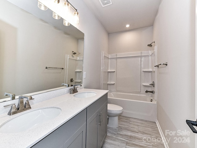 full bathroom with shower / tub combination, vanity, and toilet