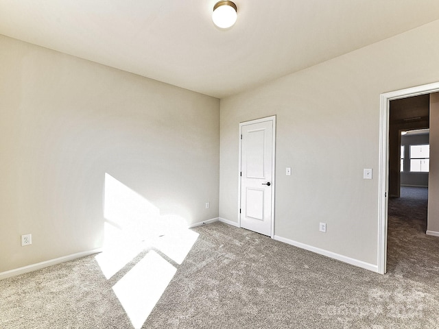 spare room featuring carpet flooring