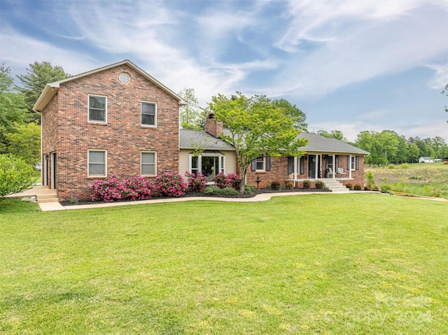 view of front of home with a front lawn and a garage