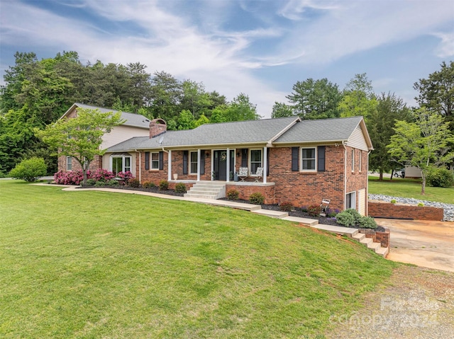 ranch-style house with a garage, a front yard, and a porch