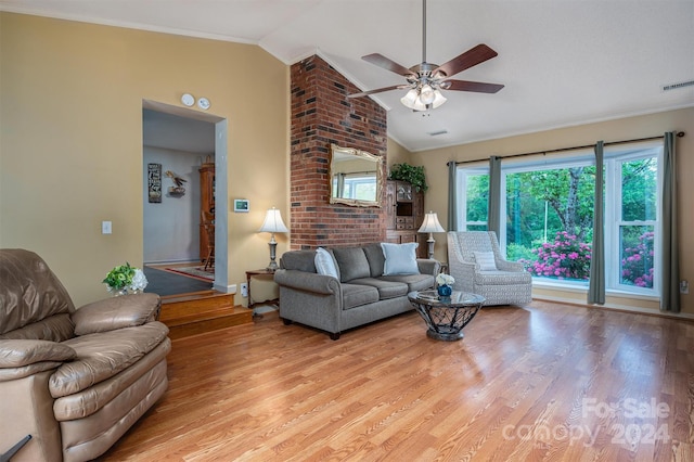 living room with light hardwood / wood-style floors, ceiling fan, crown molding, and vaulted ceiling