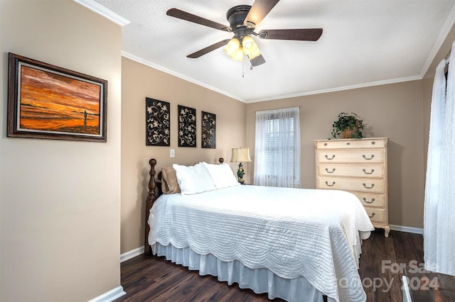 bedroom featuring ornamental molding, dark hardwood / wood-style flooring, a textured ceiling, and ceiling fan