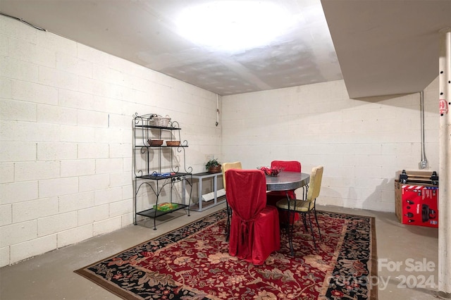 dining area featuring concrete floors