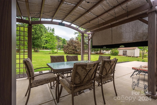 view of patio / terrace featuring a storage unit