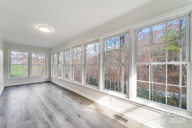 unfurnished sunroom featuring a healthy amount of sunlight