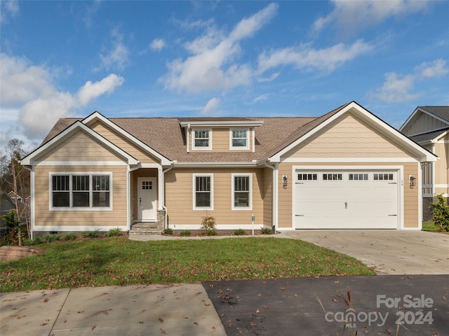 craftsman-style house with a garage and a front yard