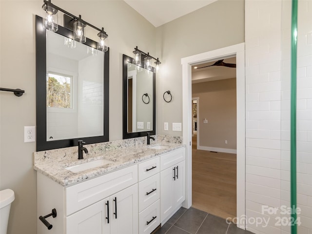 bathroom featuring toilet, vanity, and hardwood / wood-style flooring