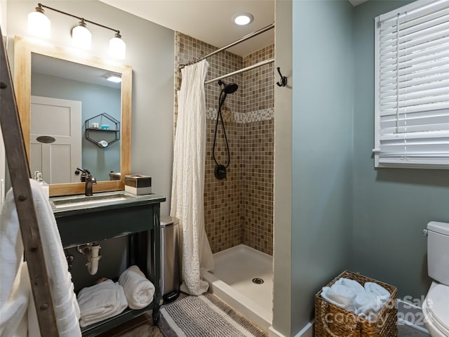 bathroom featuring walk in shower, sink, and toilet