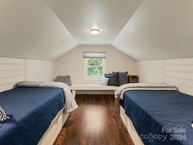 bedroom featuring dark hardwood / wood-style floors and vaulted ceiling