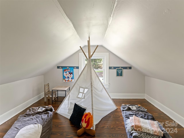 playroom featuring dark hardwood / wood-style floors and vaulted ceiling