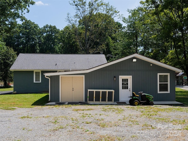 view of outbuilding featuring a yard