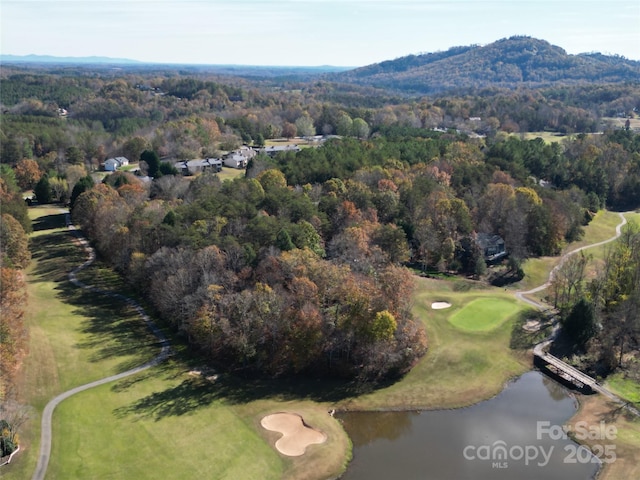 drone / aerial view featuring a water and mountain view