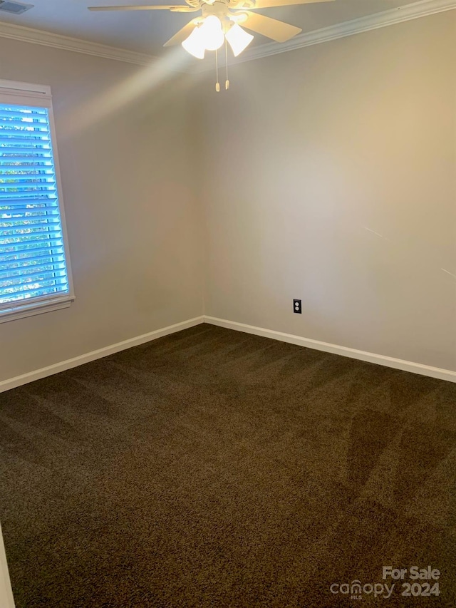 unfurnished room featuring carpet flooring, ceiling fan, and crown molding