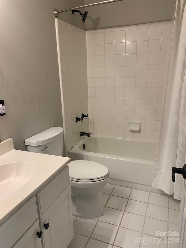 full bathroom featuring tile patterned floors, vanity, shower / tub combo, and toilet