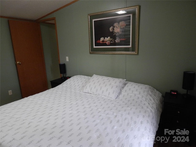 bedroom with crown molding