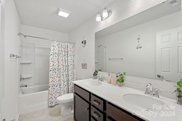 full bathroom featuring tile patterned floors, shower / bath combo, toilet, and vanity