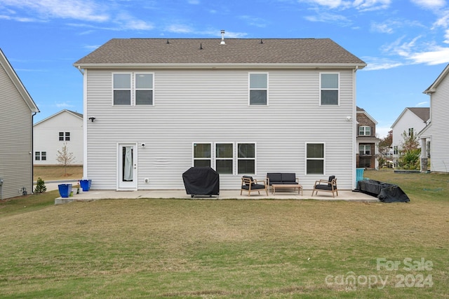 back of house with an outdoor living space, a yard, and a patio area