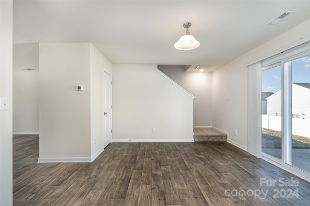 unfurnished room featuring dark hardwood / wood-style flooring