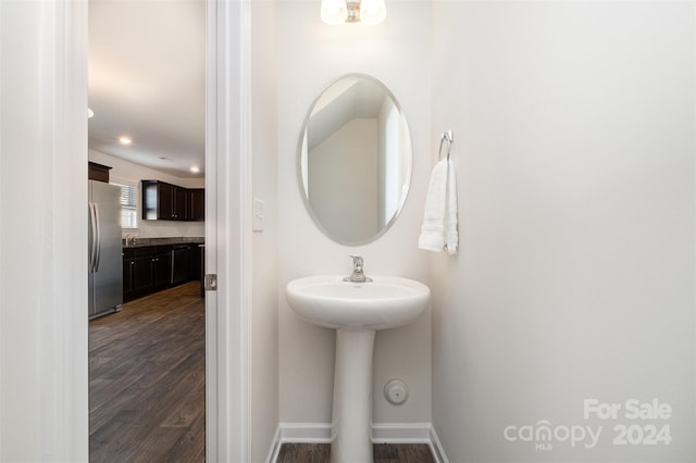 bathroom featuring hardwood / wood-style flooring and sink