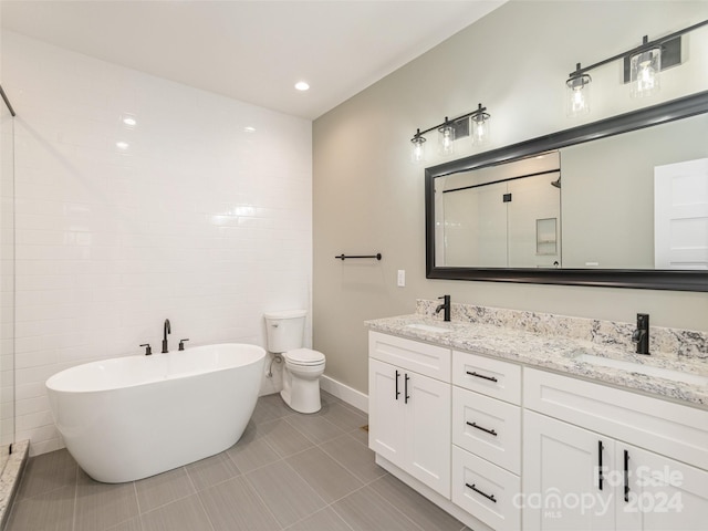 full bathroom with vanity, tile patterned floors, toilet, separate shower and tub, and tile walls