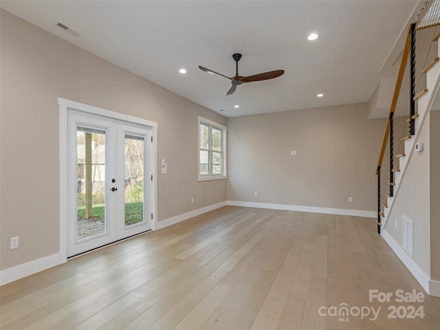 interior space with french doors, light wood-type flooring, and ceiling fan