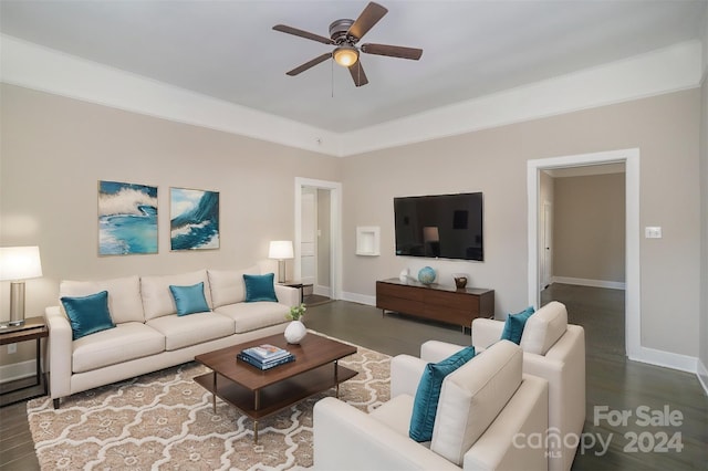 living room featuring dark hardwood / wood-style flooring and ceiling fan