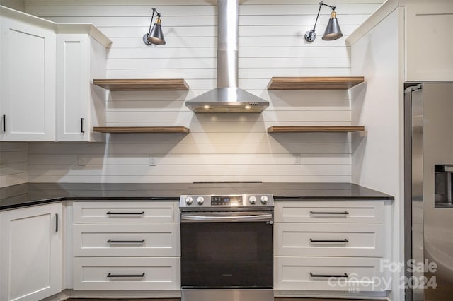 kitchen with white cabinetry, appliances with stainless steel finishes, exhaust hood, and backsplash