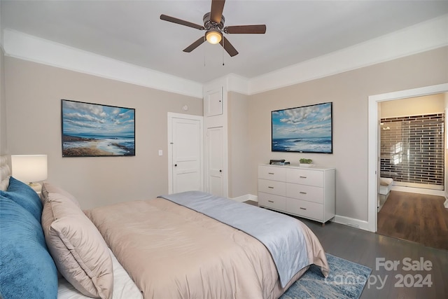 bedroom featuring ceiling fan, connected bathroom, and dark hardwood / wood-style flooring