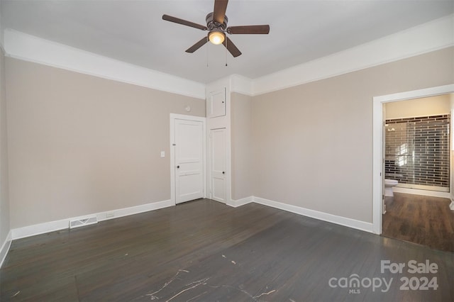 unfurnished room with ceiling fan and dark hardwood / wood-style floors