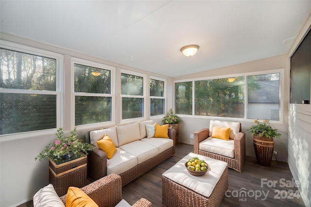 sunroom featuring vaulted ceiling